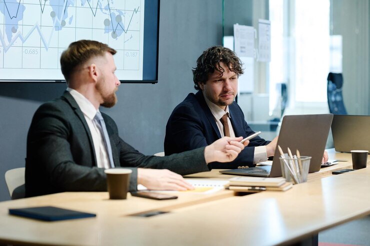 business-colleagues-working-laptop-conference_249974-13254