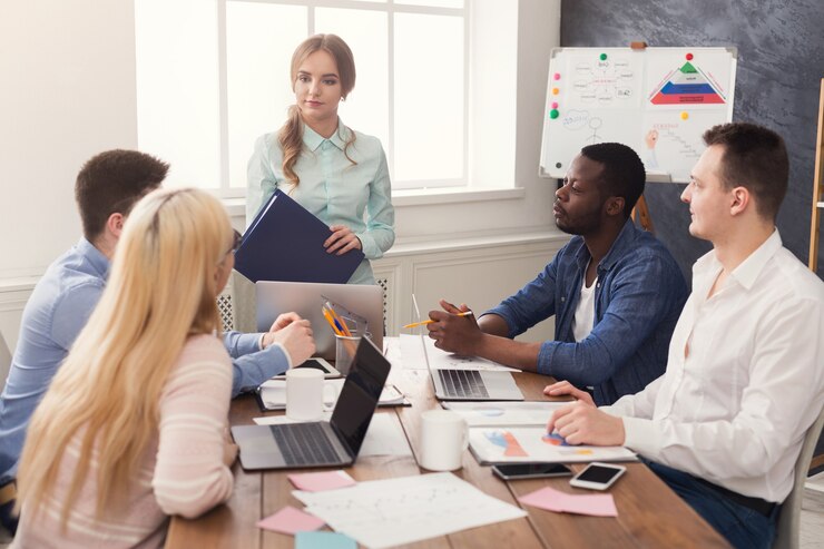 business-corporate-meeting-young-successful-team-with-female-boss-office-discussion-communication-with-partners-copy-space_116547-4500