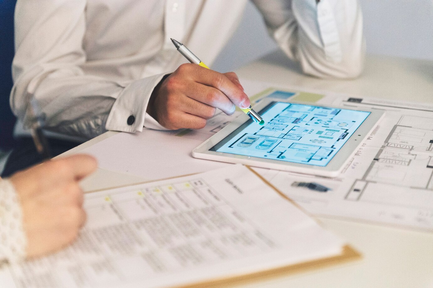 crop-people-working-with-plans-tablet_23-2147785639